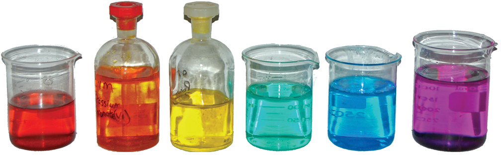 jars filled with liquids the colors of the rainbow
