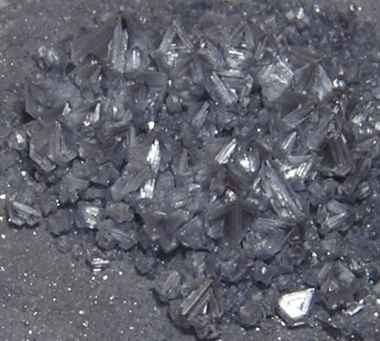 shiny silver material becomes progressively more brown and dull