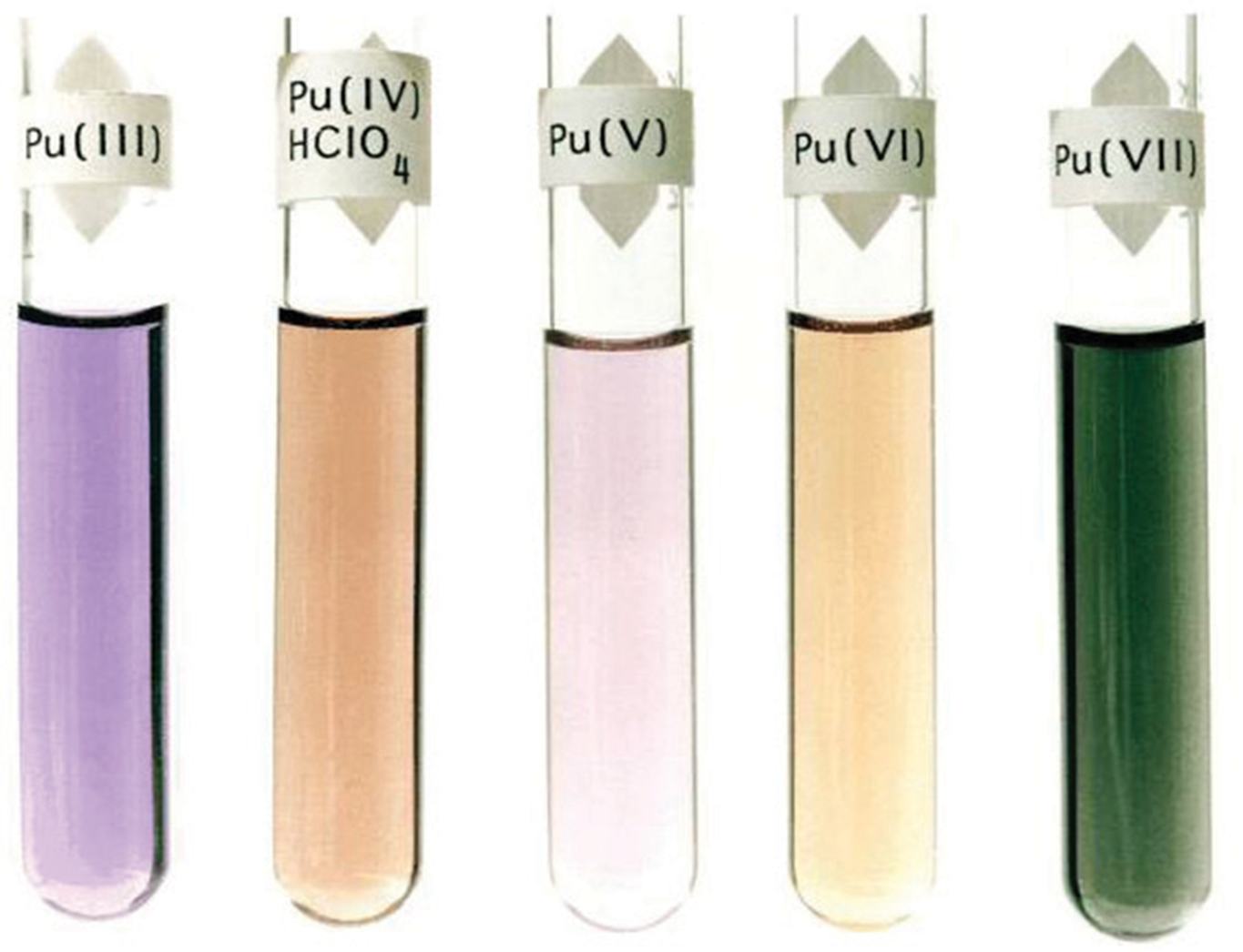 five solutions with very different colors, corresponding to plutonium(III) through plutonium(VII)